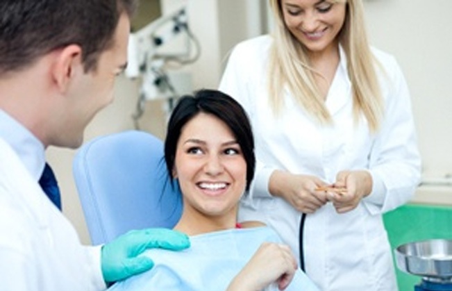 Woman in dental chair smiling