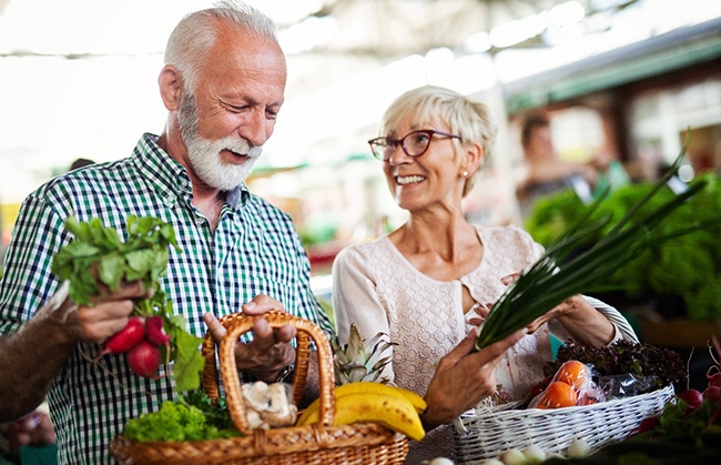 older couple shopping for healthy foods
