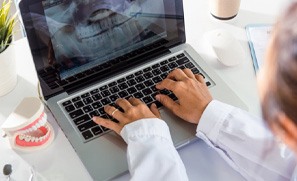 a dentist working on digital impressions