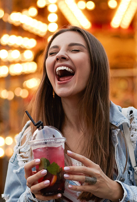 Laughing woman with flawless smile thanks to cosmetic dental bonding