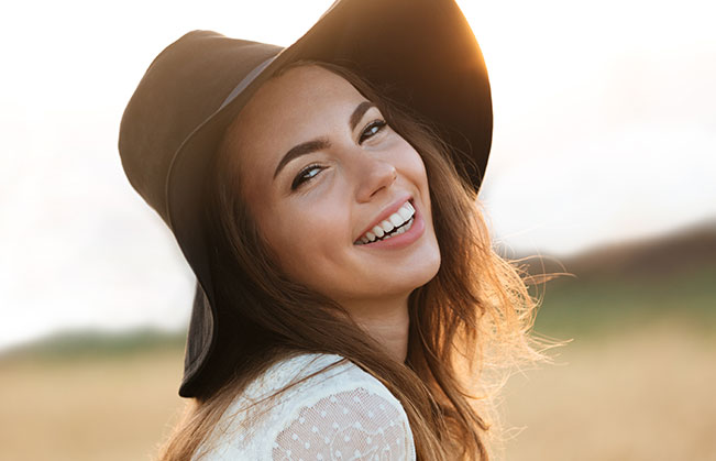 Woman smiling after dental bonding