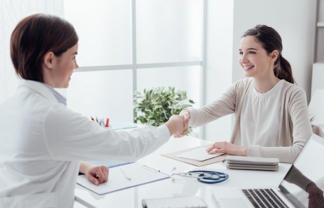 Dental team member reviewing dental insurance forms