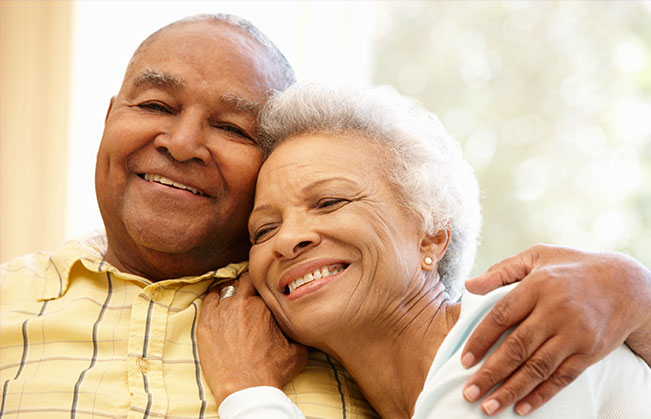 Man and woman with dentures smiling