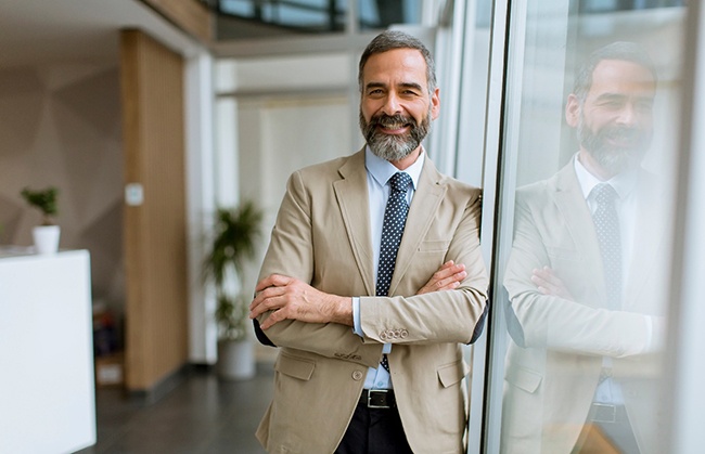 Man smiling in an office