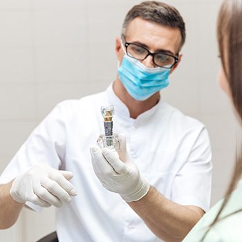 Dentist discussing dental implant with patient