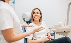 woman talking to dentist 