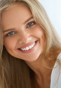 closeup of young woman smiling after cosmetic dentistry