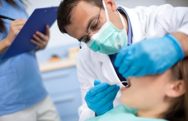 Dentist treating dental patient