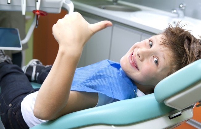 Smiling child in dental chair