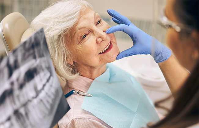 Dentist examining dental patient