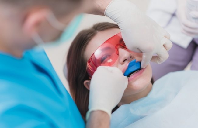 Dental patient receiving fluoride treatment