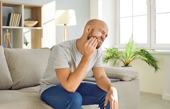 a man experiencing a failed dental implant in Kent