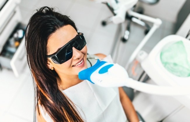 Woman receiving teeth whitening