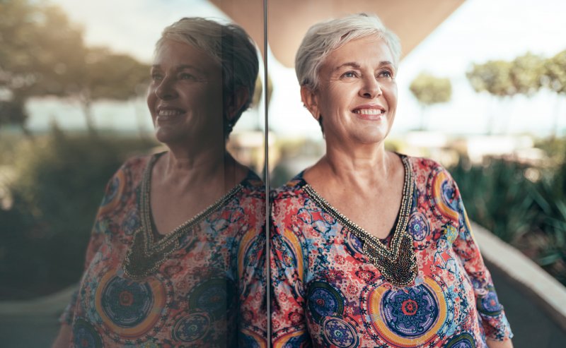 a woman enjoying the transition from dentures in Kent