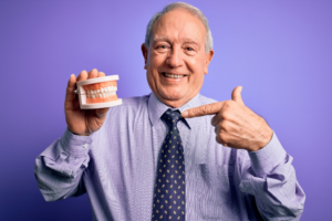 a patient with dentures smiling